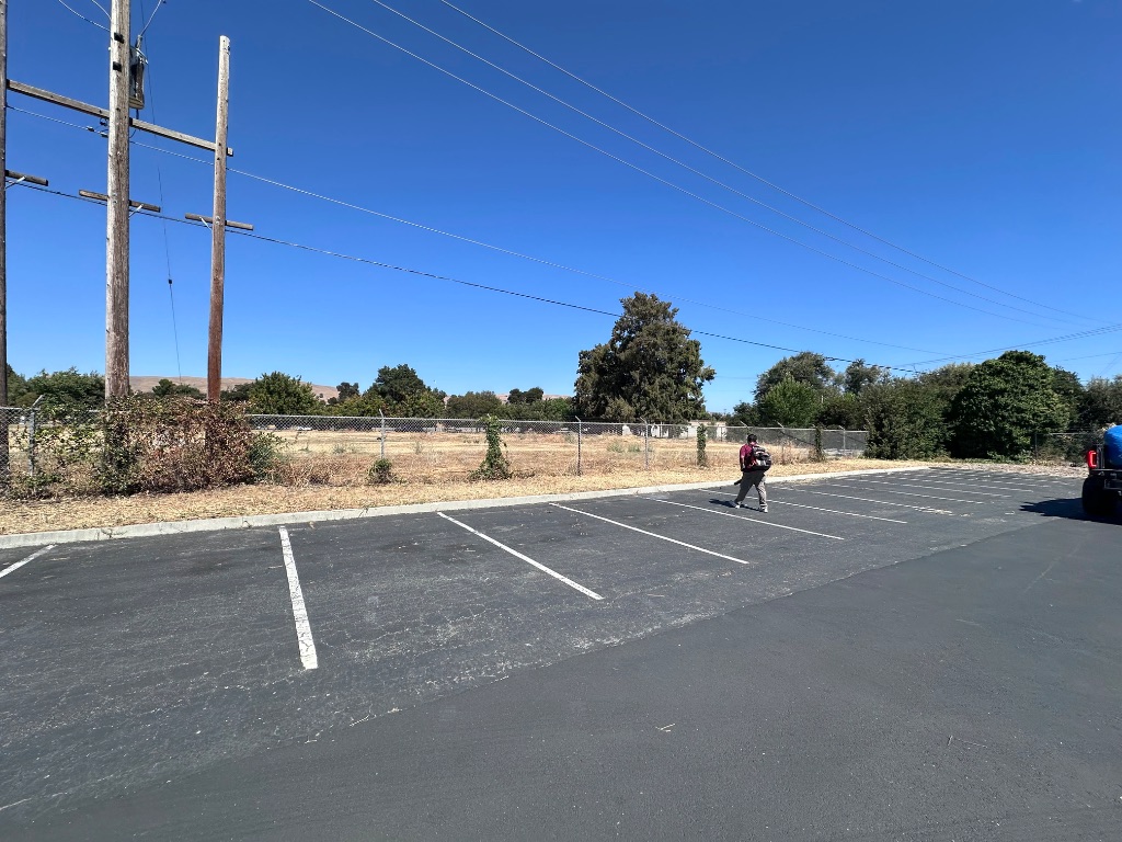 Junk hauling and property cleanout in Bay Area — cleared commercial lot by Deluxe Building Services